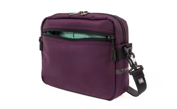 The Side Kick in Aubergine (dark purple) Ballistic with an Seafoam (pale green with white grid) 200 Halcyon interior.